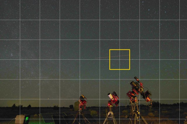 A full-resolution star trail frame cut into a grid of tiles, an airplane trail crossing the sky